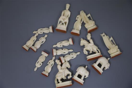 A rare 18th century white and brown walrus ivory Russian chess set, featuring Russians against Persians, in mahogany box,